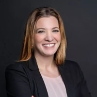 Sabra_Sciolaro seen with a bright smile on her face and in a formal outfit